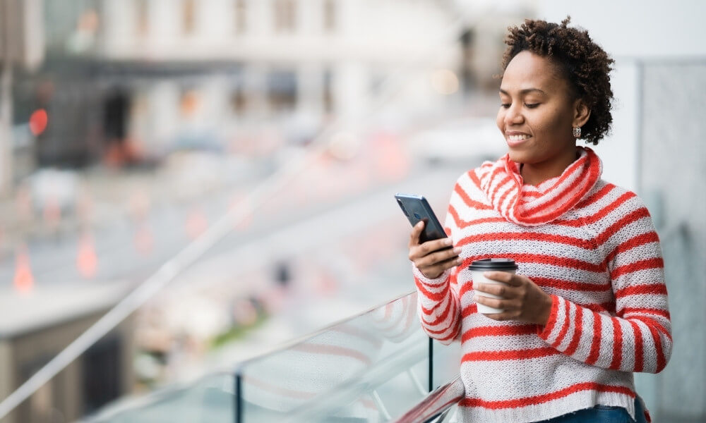 Black woman look at smartphone